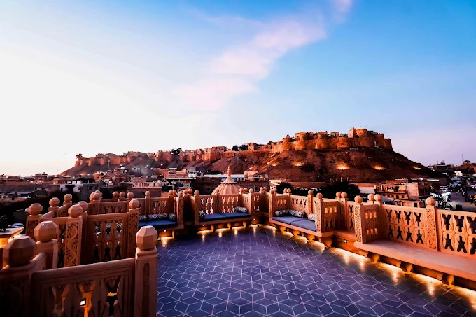 Jaisalmer Fort glowing at dusk from the Guulab Haveli rooftop